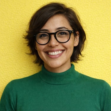 Smiling woman with medium skin tone, short dark hair, glasses, green turtleneck, yellow background