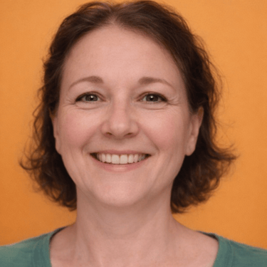 Smiling woman with short brown hair against an orange background. She wears a green shirt.