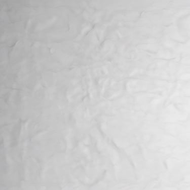 A solar-powered irrigation pump operating in a lush green farm field under bright sunlight.