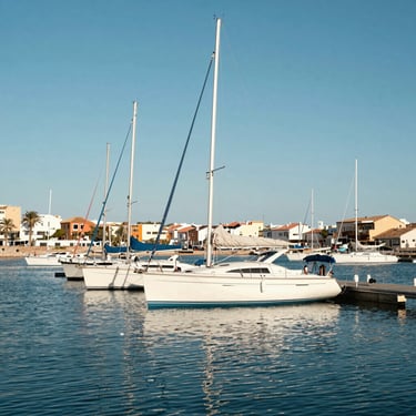 Beautiful marina in San Javier with white sailboats resting on the calm blue water of Mar Menor, clear sunny sky
