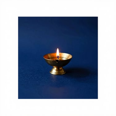 Elegant album artwork mockup for a Malayalam devotional song, featuring a golden oil lamp against a deep royal blue background, minimalist design, 35mm