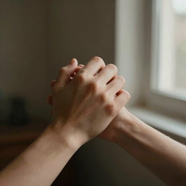 Tight detail of a couple's hands gently intertwined, warm window light casting soft shadows, intimate and quiet atmosphere.