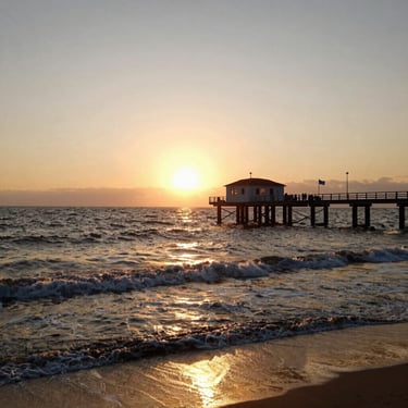 A satisfied customer shaking hands with a Vanishguard pest control technician in front of a tidy apartment building.