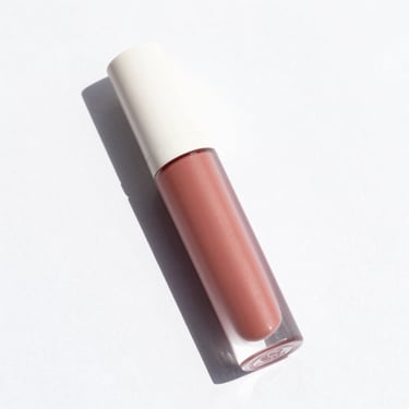 clean product shot of a long-lasting matte liquid lipstick, bright high-key natural light, clean white background, sharp focus, 35mm