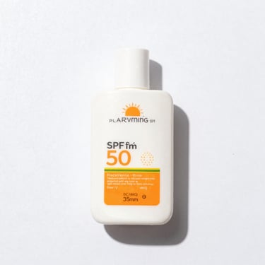 clean product shot of a facial sunscreen bottle with SPF 50, bright high-key natural light, clean white background, sharp focus, 35mm
