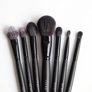 clean product shot of a makeup brush set, bright high-key natural light, clean white background, sharp focus, 35mm