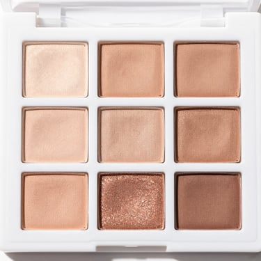 clean product shot of a neutral eyeshadow palette, bright high-key natural light, clean white background, sharp focus, 35mm