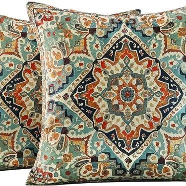 Set of two decorative throw pillows with a vintage medallion tapestry pattern in teal and orange.