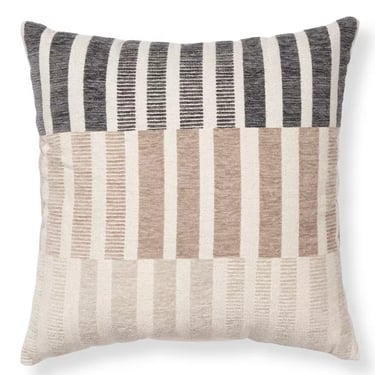 Modern decorative throw pillow with black, tan, and cream striped textured patchwork design.