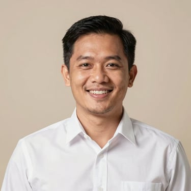 Professional and warm headshot of a friendly Indonesian male sales consultant in a clean white shirt, soft studio lighting, smiling confidently