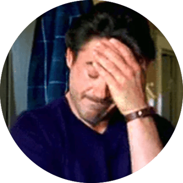 A man placing his hand to his head, displaying frustration.