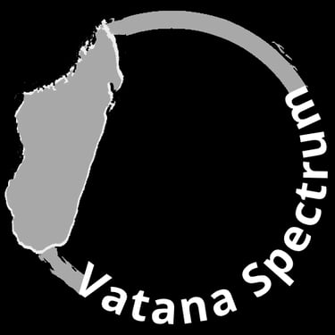 Vatana Spectrum logo featuring a gray map of Madagascar inside a circular arch on a black background.