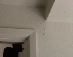 drywall crack above doorway