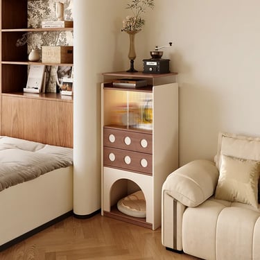 Furniture-style cat cabinet with a rounded entrance, storage drawers and calm neutral colors beside 