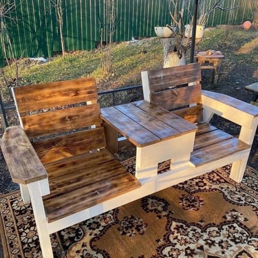 Simple wooden garden bench used as outdoor seating, bringing warmth, comfort and natural texture to
