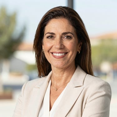 Professional headshot of Laura Carrasco, local representative of Guadarrama, smiling, bright natural background, professional attire