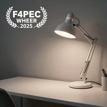 A serene workspace with a white desk lamp and a clear, distraction-free environment.