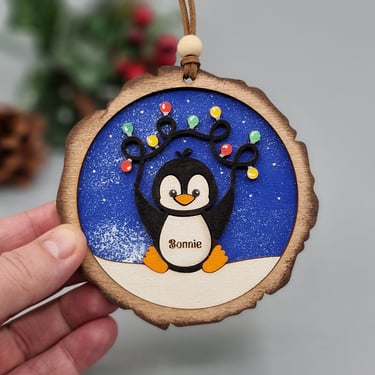 personalised penguin bauble with christmas lights