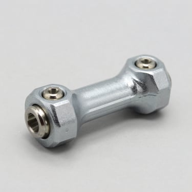 Macro product shot of a rear stabilizer link, clean light gray studio background, sharp focus on ball joints.