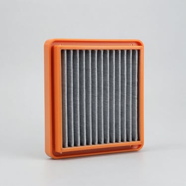 Studio shot of a pleated rectangular engine air filter with orange rubber frame, crisp lighting, gray background