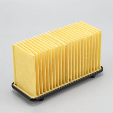 Crisp product shot of a yellow pleated engine air filter, light gray background