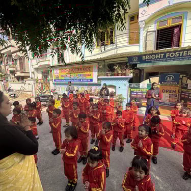 Students in red uniforms pray during morning assembly at Bright Foster Kidz preschool campus.