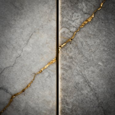 Macro photography of two perfectly matched marble slabs joining seamlessly, golden veins flowing across the joint, sharp focus.