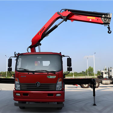 A red truck with a 5 ton knuckle boom truck mounted crane.