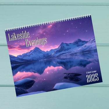 a landscape themed calendar with a lake, mountains and bright skyline on the cover