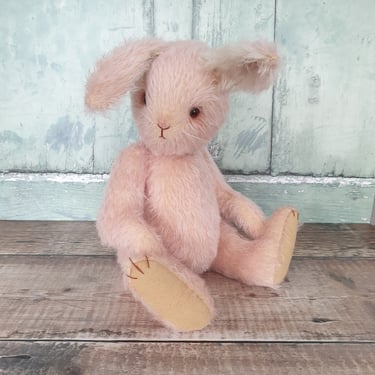 a handmade mohair bunny rabbit sitting down
