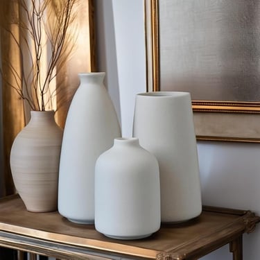 Neutral decorative vases for modern living room shelf or table styling.