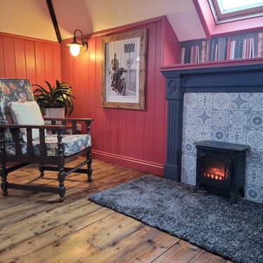 Cosy fire and fireside chair. Llangammarch Wells.