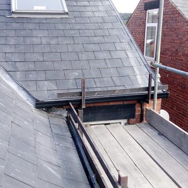 A replacement roof around a skylight. 