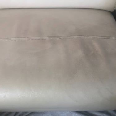 close up of a dirty leather sofa seat