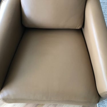 cleaned dark brown leather armchair by a professional leather cleaner