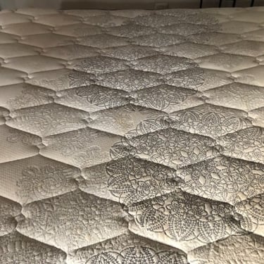 dirty queen mattress top with brown staining