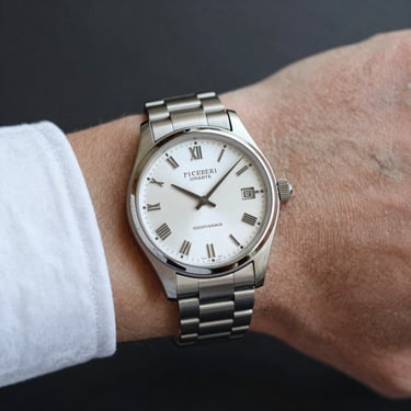 A large white structure sitting on top of a body of water