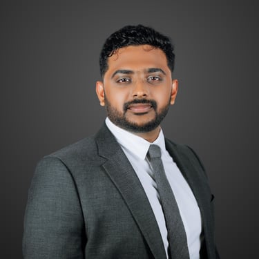 a man in a suit and tie with a beard