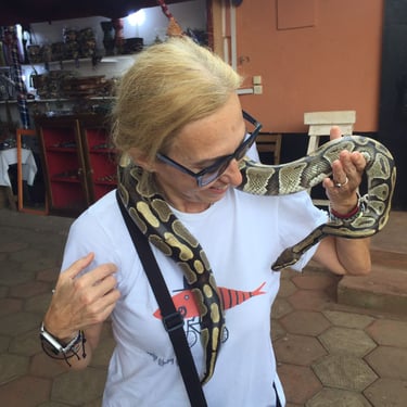 A Greek Tourist visiting Pythons Temple in Benin with Dahomey African Tours