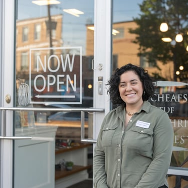 Lisa M. business owner standing outside Capital Region store