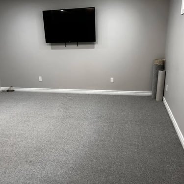 Selkirk dark grey carpet installed wall-to-wall in basement of London Ontario home, durable and soft flooring