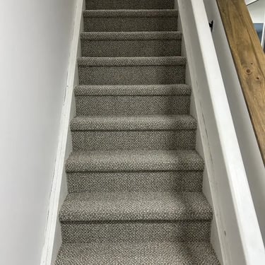 Finished Berber carpet on a home staircase in London, Ontario, installed by Master Carpet