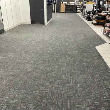 Mark's commercial carpet tile installed wall-to-wall in retail store section, durable and professional flooring in Ontario