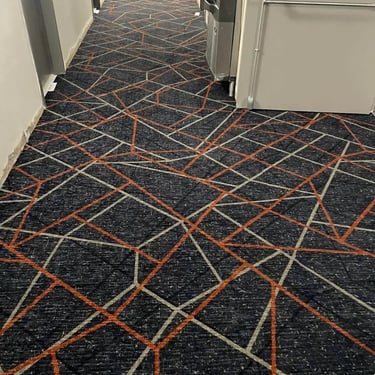 Holiday Inn commercial patterned carpet installed wall-to-wall in hotel hallway, durable and stylish flooring in Ontario