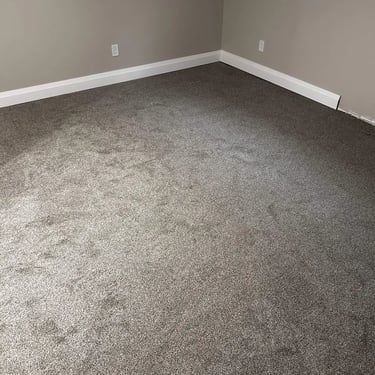 Grey carpet installed in a London, ON bedroom – soft and durable carpet for comfortable living.