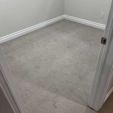 Grey Berber carpet installed in a London bedroom – soft, durable carpet providing comfort and style.
