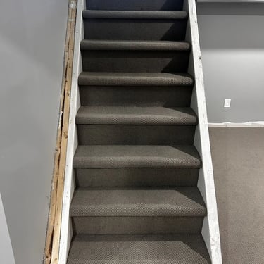 Ace low pile berber carpet installed wall-to-wall on residential stairs in East London Ontario home