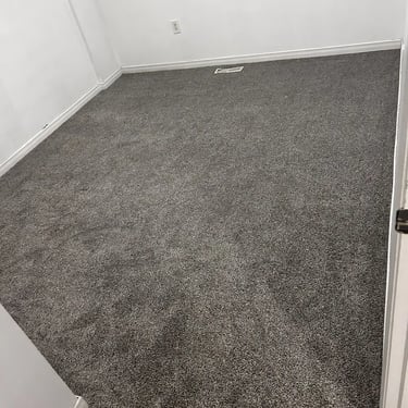 Melford low pile grey carpet installed wall-to-wall in bedroom – soft and cozy flooring in London Ontario home