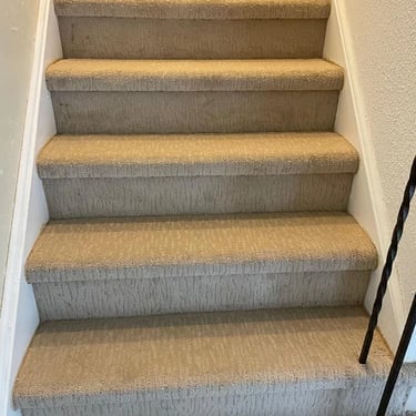 Beige patterned carpet installed wall-to-wall on residential stairs in London Ontario, stylish and durable flooring