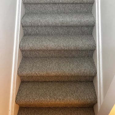 Gladiator berber carpet installed on stairs – durable and textured stair carpeting in residential hallway